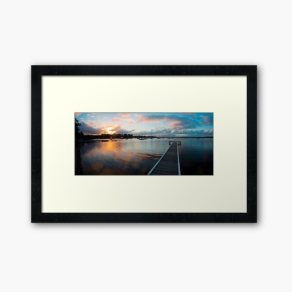 Sunset over the water Framed Art Print