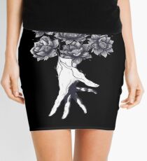 Hand with lotuses on black Mini Skirt