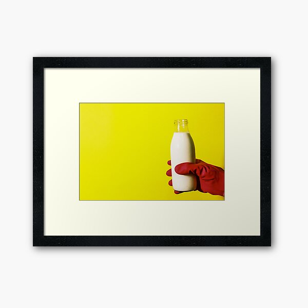 Poured Milk on a Yellow Background Framed Art Print