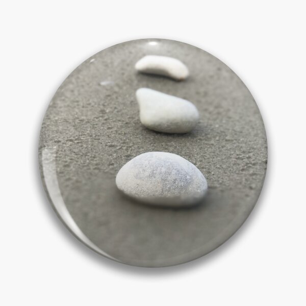 Item preview, Simple closeup view of vertically arranged three white stones on grey sandy beach designed and sold by Khala.