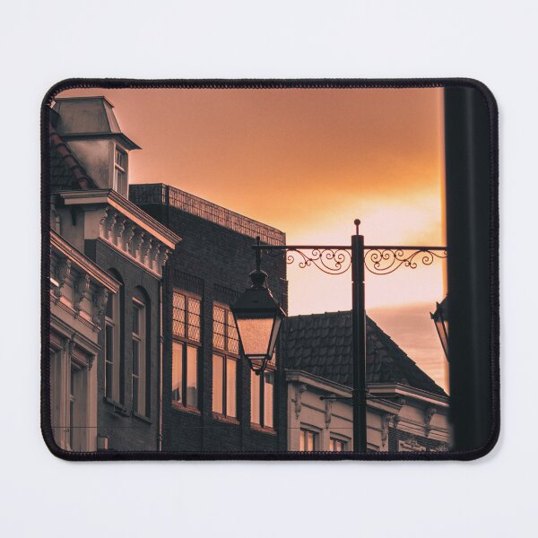 Item preview, Inner city rooftops against orange sunset designed and sold by roeltimmermans.