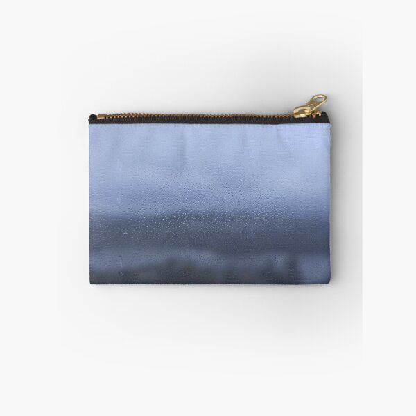Item preview, Rain water droplets on glass with out-of-focus landscape background designed and sold by Travis Peterson.