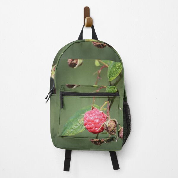 Item preview, Raspberries growing on a bush with a blurred green background designed and sold by AlishaWatson.