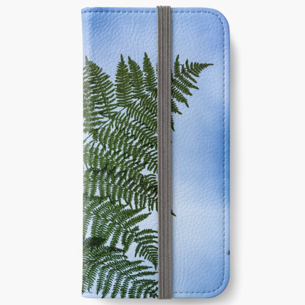 Fern leaf against a blue cloudy sky iPhone Wallet
