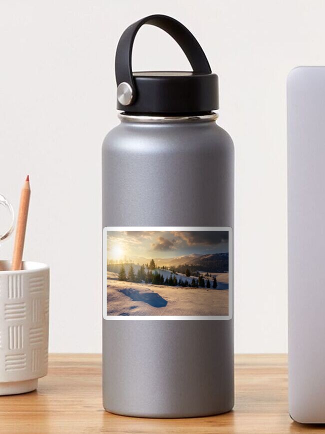 Thumbnail 1 of 3, Sticker, spruce forest on snowy meadow in high mountains at sunset designed and sold by mike-pellinni.