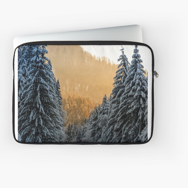 snowy road through spruce forest at sunset Laptop Sleeve