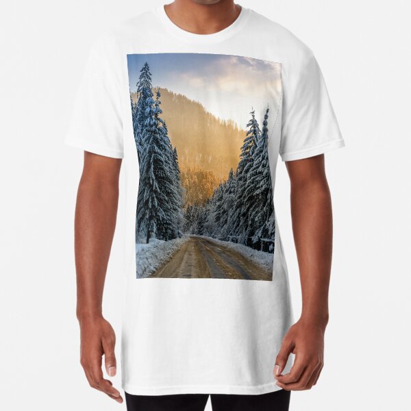 snowy road through spruce forest at sunset Long T-Shirt