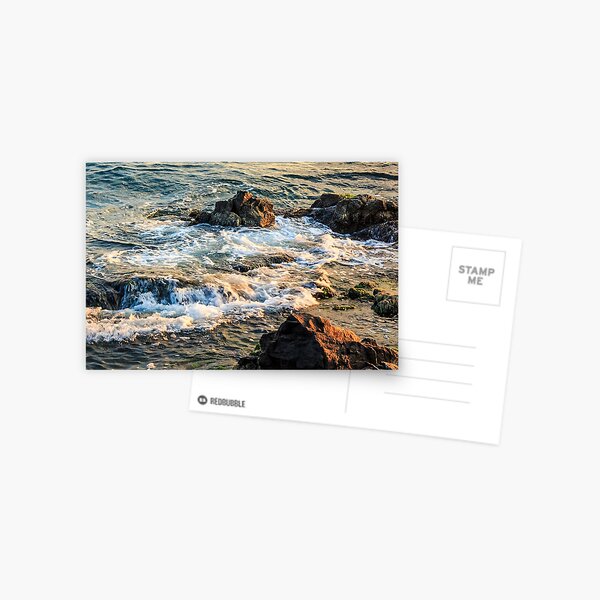 wave rolls onto the rocky coast Postcard