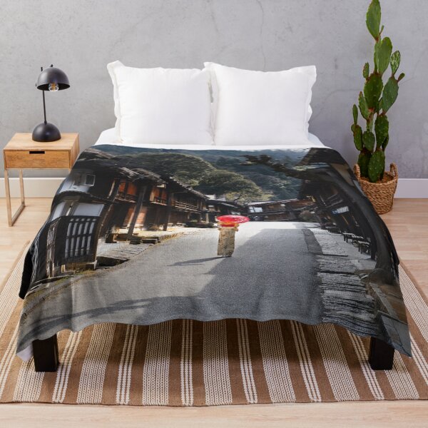 Item preview, Woman under red umbrella walking along the street in rural Japan designed and sold by Raureif.