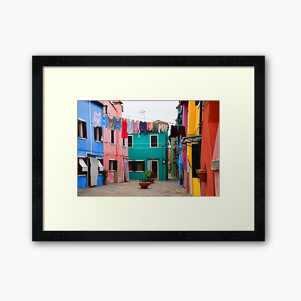 Hanging laundry from Colorful houses Burano Italy Photography Framed Art Print