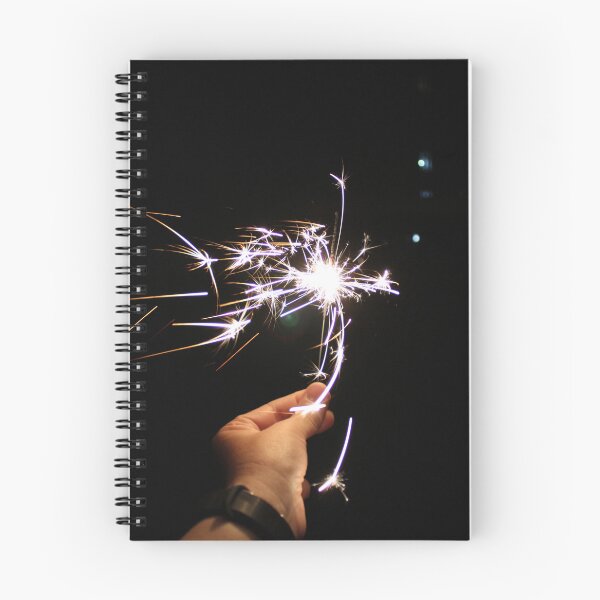 Item preview, Burning sparkler in hand on a black background designed and sold by yulchikon.