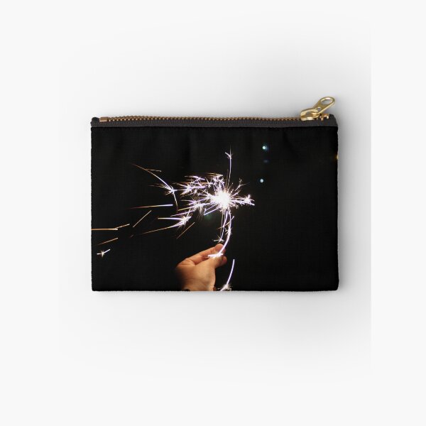Item preview, Burning sparkler in hand on a black background designed and sold by yulchikon.