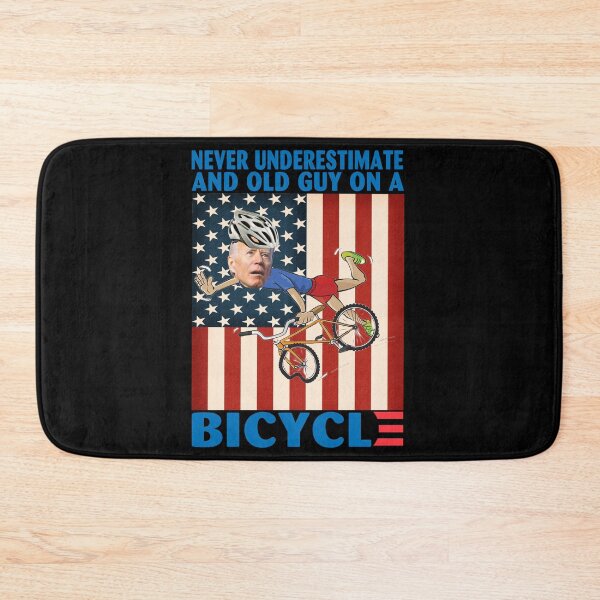 Item preview, Never Underestimate An Old Guy on a Bicycle Funny Biden Falling off designed and sold by adolfonewell04.