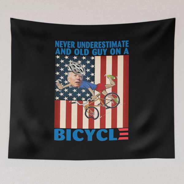Item preview, Never Underestimate An Old Guy on a Bicycle Funny Biden Falling off designed and sold by adolfonewell04.