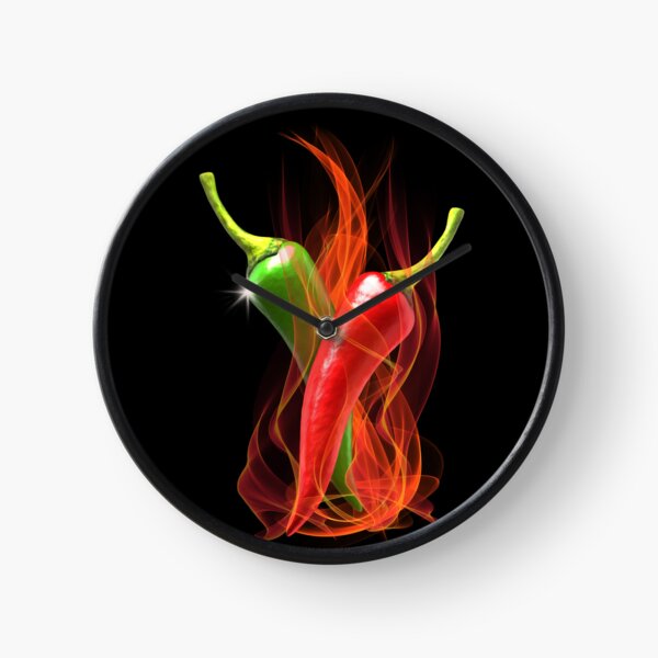 Burning Chilli Peppers..A dramatic design using red and green spicy chilli peppers and hot flames set against a black background Clock