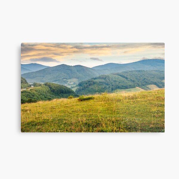 grassy meadow in mountains at sunrise Metal Print