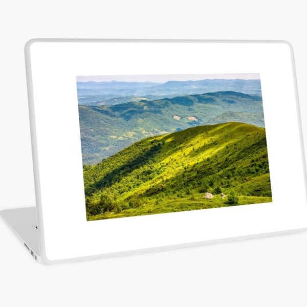 grassy hillside on mountain in summer Laptop Skin