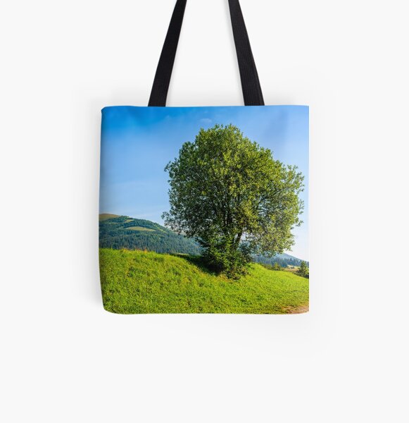 tree in rural area on beautiful summer day All Over Print Tote Bag