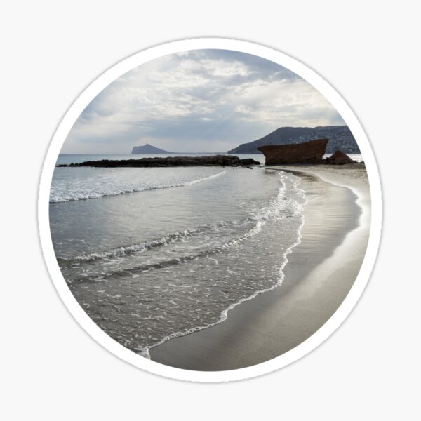Clouds, light and water on the sandy beach in Calpe Sticker
