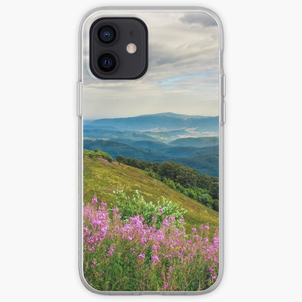 meadow with purple flowers in mountains iPhone Soft Case