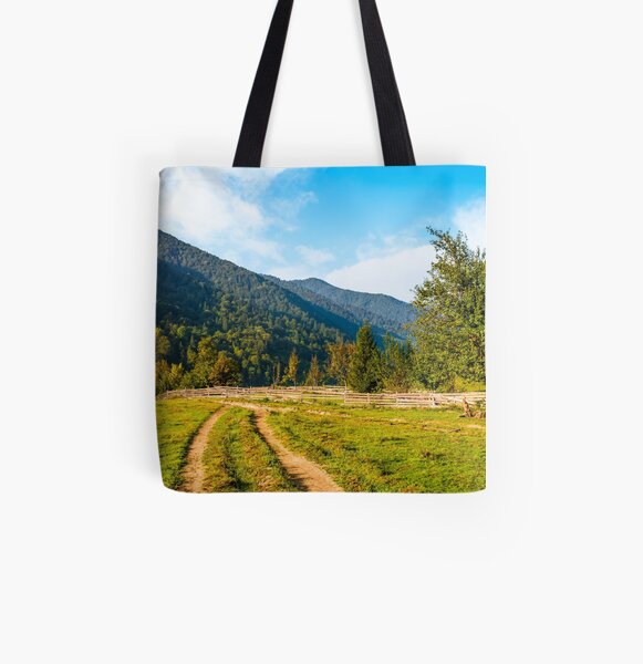 orchrd behind the fence in mountains All Over Print Tote Bag