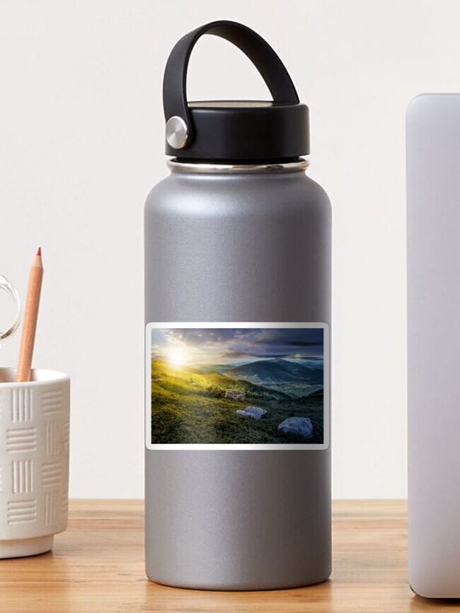 Thumbnail 1 of 3, Sticker, time change over stones on the edge of mountain hillside designed and sold by mike-pellinni.