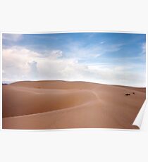 Desert dunes landscape with blue skies and white clouds. Poster