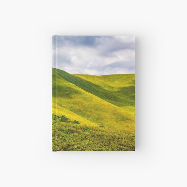 grassy hillside on mountain in summer Hardcover Journal