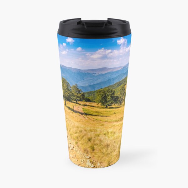 Countryside road in mountains at sunset Travel Mug