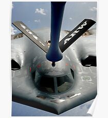 A B-2 Spirit aircraft getting in position to refuel from a KC-135 Stratotanker over the Pacific Ocean. Poster
