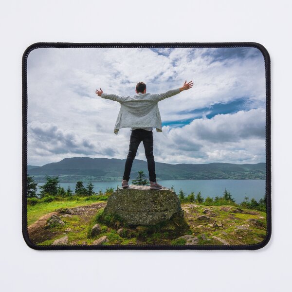 Item preview, A man standing on a rock, high on a hill,  enjoying views of the Atlantic Ocean, mountains and cloudy skies in Ireland designed and sold by AlbertMi.