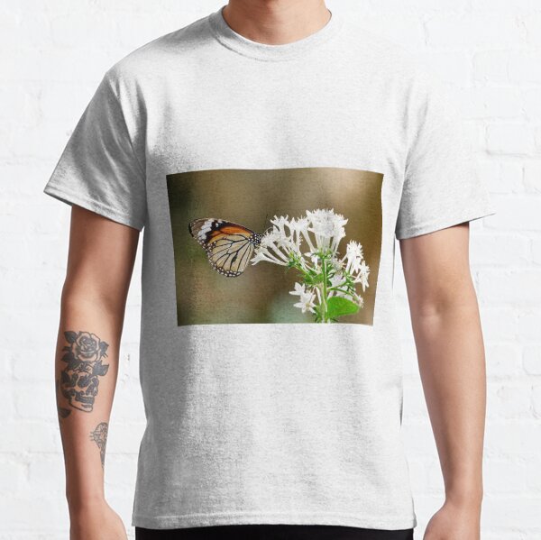 A butterfly is sitting on white flowers. Classic T-Shirt