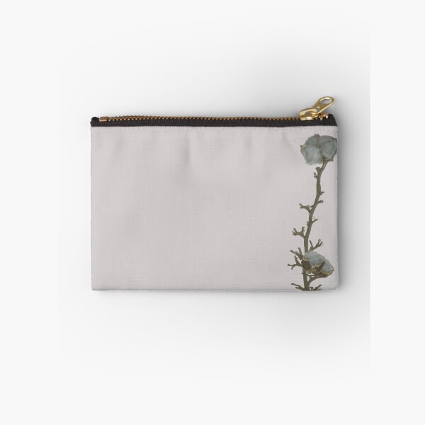 Item preview, Una sola ramita de cápsula de algodón azul gris natural apoyada contra el fondo de la pared blanca iluminada designed and sold by Khala.