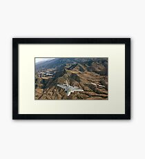 A World War II-era P-47 Thunderbolt, an F-22A and a TF-51 Mustang fly in formation. Framed Print