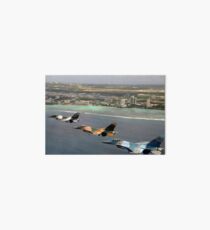 Three F-16 Fighting Falcons fly in formation over Tumon Bay, Guam. Art Board