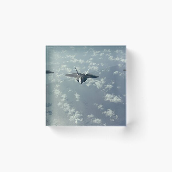 Item preview, A three-ship formation of F-22 Raptors fly over the Pacific Ocean. designed and sold by StocktrekImages.