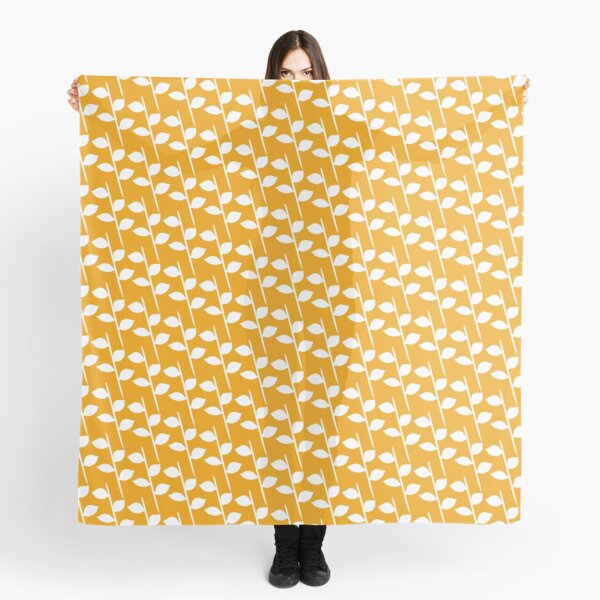 White steams with leaves on a warm marigold orange background Scarf