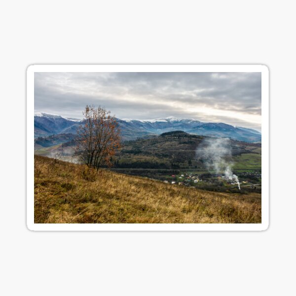 snowy peaks over rural area in autumn Sticker