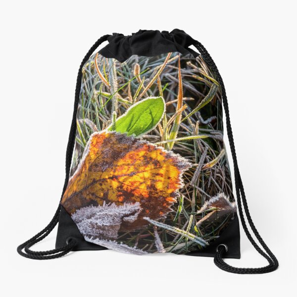 yellow and green foliage in the grass Drawstring Bag