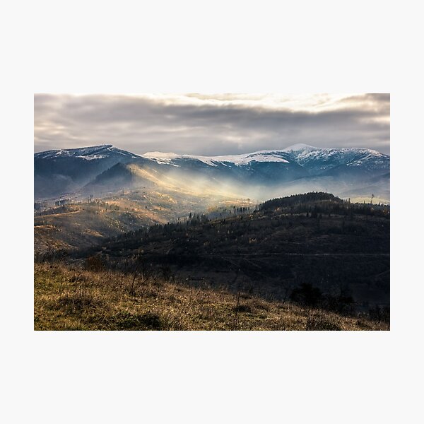 snowy peaks over hillsides in fog Photographic Print