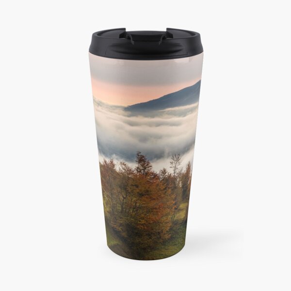 foggy sunrise in high mountains Travel Mug