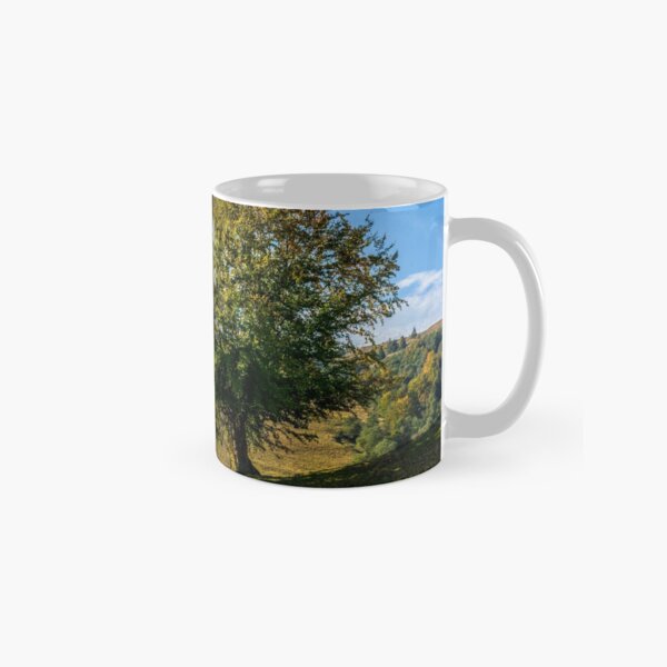 tree near valley in mountains Classic Mug