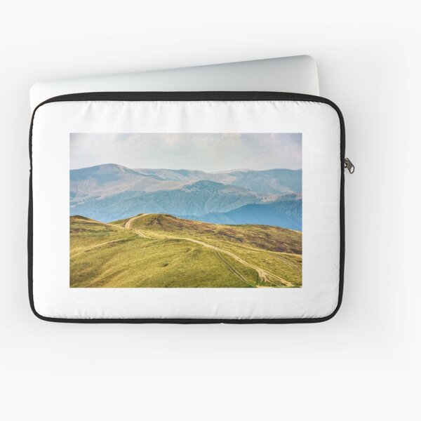 road through a meadow on hillside Laptop Sleeve
