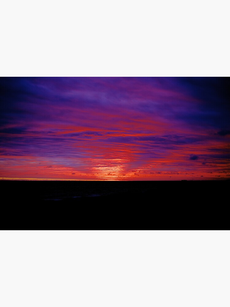 "Amethyst pink sunrise burning bright on underbelly of clouds purple