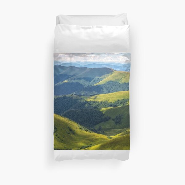 valley between green hills in summer Duvet Cover
