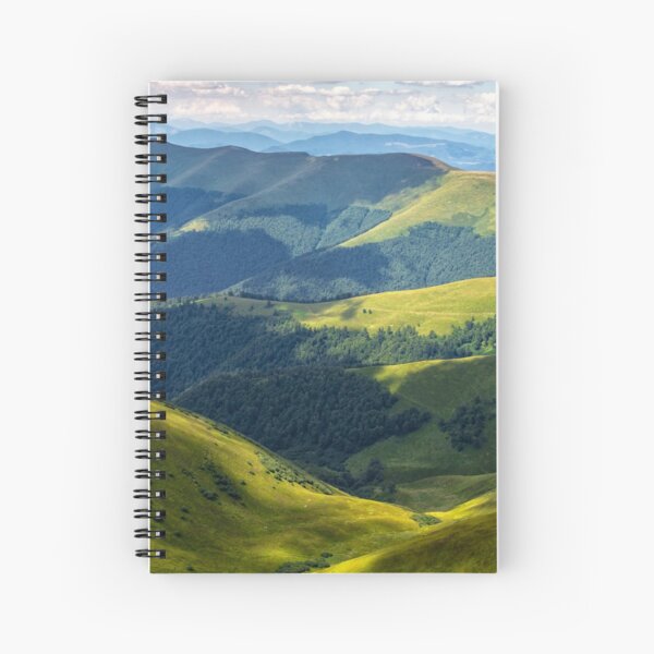 valley between green hills in summer Spiral Notebook