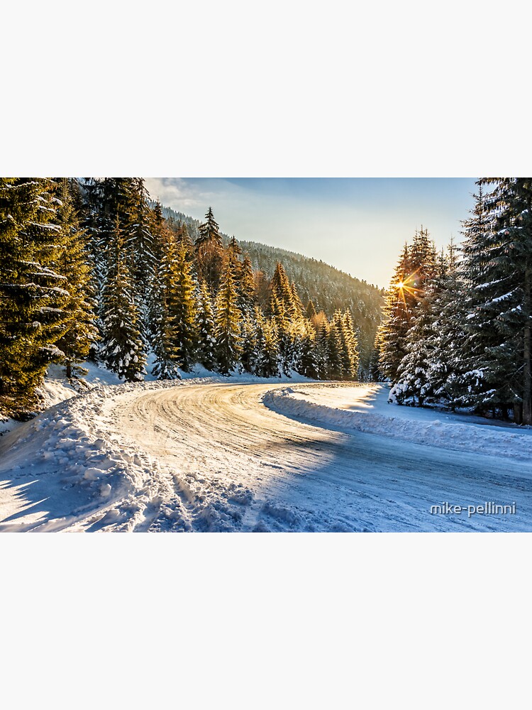 Thumbnail 3 of 3, Sticker, snowy road through spruce forest in mountains designed and sold by mike-pellinni.