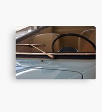 Detail of hood with windshield and steering wheel of blue car Canvas Print