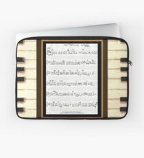 Piano keys with sheet music by Kristie Hubler Laptop Sleeve