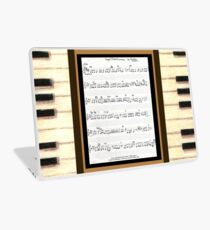 Piano keys with sheet music by Kristie Hubler Laptop Skin
